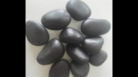 这是什么石头！表面光滑颜色呈黑褐色。比同体积的石头重